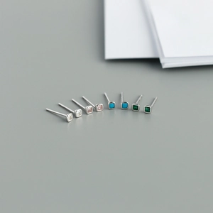 Detailed view of four pairs of square zircon stud earrings in S925 sterling silver colors