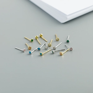 Macro shot of colorful zircon square studs with S925 sterling silver engraving