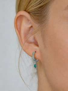 Close-up of S925 silver hoop earrings featuring a marquise-cut green gemstone drop