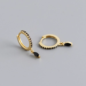 Detail of S925 silver earrings with marquise-cut black gemstone and pavé settings