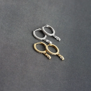 Detailed view of S925 sterling silver hoop earrings with marquise cut crystal pendants