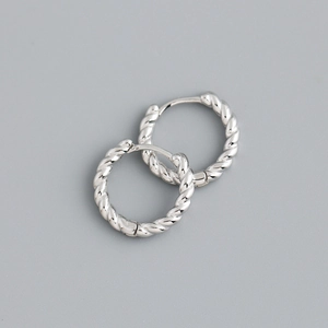 Detailed macro shot of S925 sterling silver twisted hoop earrings with textured spiral design