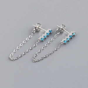 Detailed close-up of S925 sterling silver earrings with turquoise stones and fringe chain