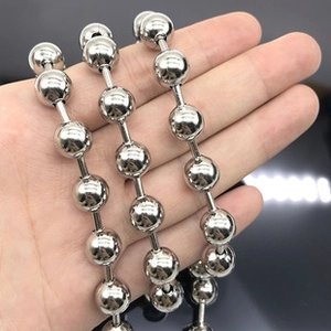 Detailed view of 8mm polished silver stainless steel ball chain held in hand