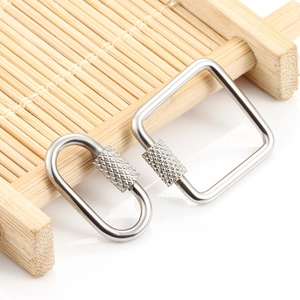 Polished stainless steel screw clasp connectors in square and oval shapes on bamboo stand