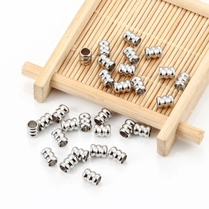 Perles intercalaires cylindriques en acier poli à trois rainures pour création de bijoux
