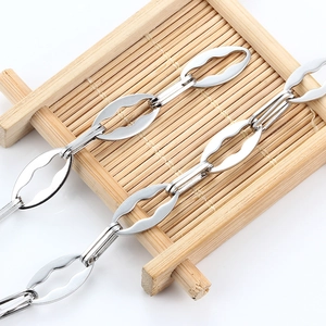 Minimalist silver stainless steel lip chain necklace with unique wave-shaped oval links