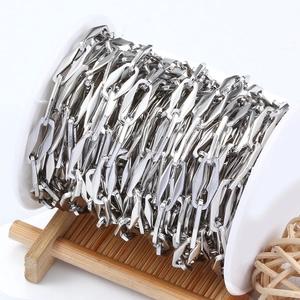 Polished silver stainless steel rhombic link chain on white spool for DIY jewelry making