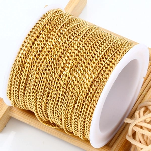 Golden stainless steel curb chain roll for DIY jewelry making on wooden stand