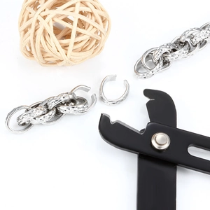 Polished silver diamond-cut chain necklace with professional black jewelry pliers tool