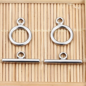 Detailed view of polished stainless steel toggle OT clasps for DIY jewelry making