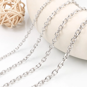 Close-up of polished stainless steel cable chain links showing metallic luster and texture