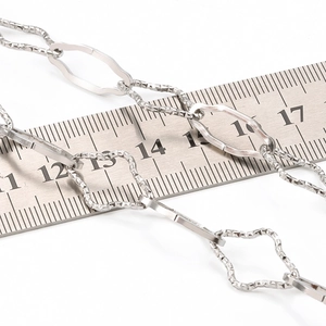 Polished stainless steel cross chain necklace with textured diamond links and ruler scale