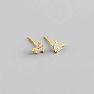 Macro shot of V-shaped marquise-cut zircon stud earrings in gold-plated silver