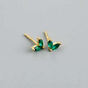 Close-up of leaf-shaped S925 silver earrings with green marquise zircon in gold finish