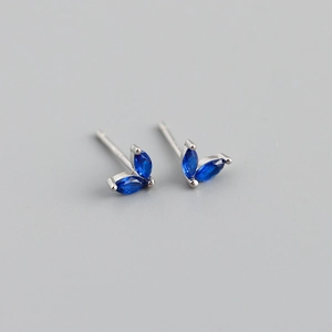 Macro detail of marquise-cut blue sapphire earrings in 925 sterling silver settings