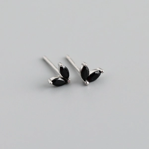Detailed macro view of S925 silver stud earrings with black marquise-cut gemstones