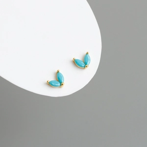 Close-up of gold S925 silver stud earrings with V-shape marquise turquoise stones