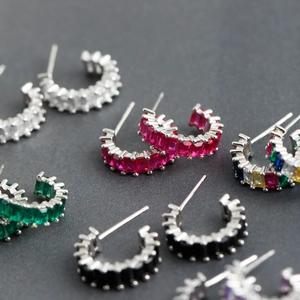 Colorful baguette-cut zircon C-shaped earrings in various vibrant gemstone colors