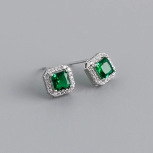 Close-up of square emerald green halo stud earrings in S925 sterling silver