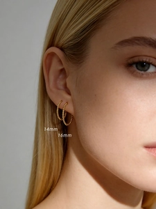Close-up of S925 sterling silver beaded hoop earrings in 14mm and 16mm sizes
