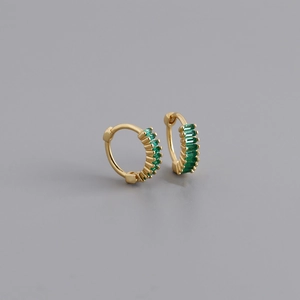 Detail of gold hoop earrings featuring rectangular emerald green zircon stones