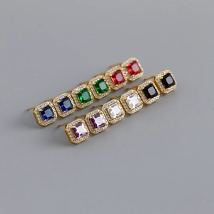 Macro shot of square halo earrings in six colors with gold finish and zircon stones