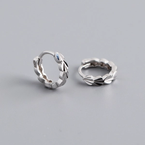 Close-up of S925 sterling silver earrings showing detailed leaf pattern and hallmark