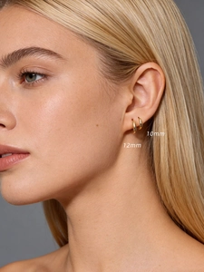 Detail showing 10mm and 12mm gold hoop earrings on ear with high-polish finish