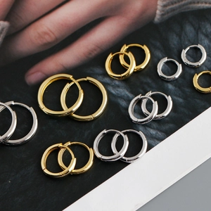 Selection of polished S925 sterling silver hoop earrings in gold and silver finishes