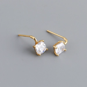 Macro shot of S925 sterling silver stamp and square-cut zircon studs in gold finish