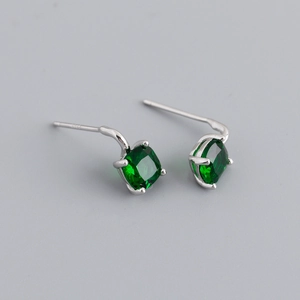 Detail view of square emerald green zircon earrings with S925 silver four-prong setting