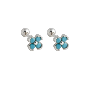 Macro view of flower stud earrings with turquoise petals and silver screw ball back