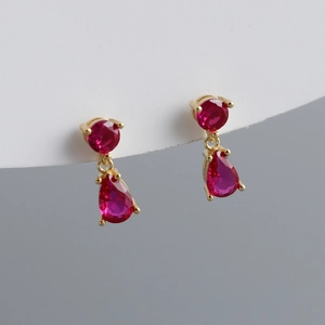Detailed view of red teardrop zircon earrings with elegant gold-plated silver setting