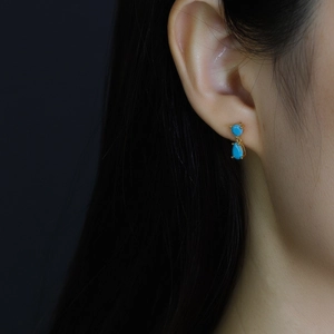 Elegant S925 silver stud earrings with teardrop blue zircon stones and gold plating