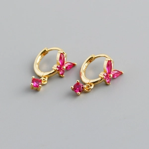 Detail of S925 gold-plated butterfly hoop earring with rose red marquise gemstones