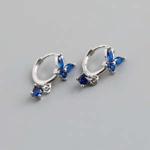 Macro view of S925 sterling silver butterfly earrings with sparkling blue zircons