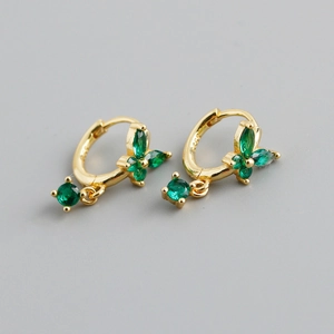 Close-up of S925 sterling silver butterfly earrings with green marquise stones