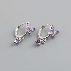 Macro shot of S925 sterling silver stamp and purple marquise butterfly earrings