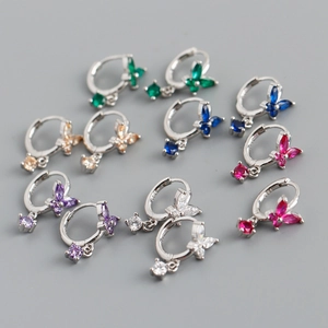 Macro shot of S925 sterling silver butterfly earrings with colorful inlaid crystals