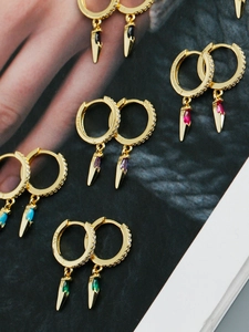 Detail of S925 sterling silver hoop earrings with dagger pendants and zircon inlay