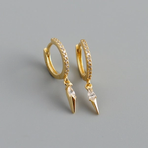 Detail of gold-plated silver hoops featuring marquise zircon and sharp cone pendants