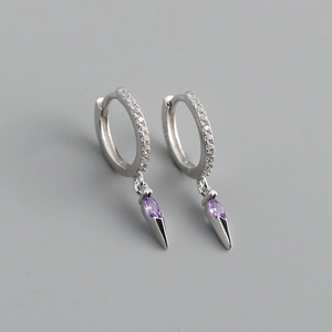 Detailed macro of S925 silver hoop earrings featuring purple marquise stone and spike charm