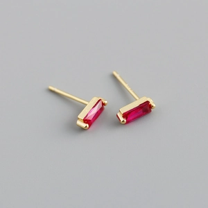 Detailed macro view of S925 sterling silver stamp on golden red zircon stud earrings