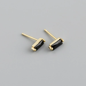Close-up of S925 silver square earrings with black zircon in a modern gold finish