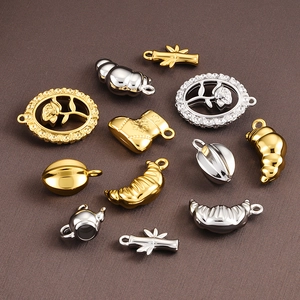 Polished gold and silver stainless steel charms with rose, bamboo, and seashell motifs