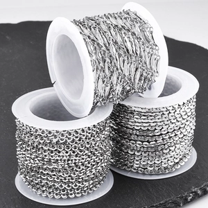 DIY stainless steel cable chain set for jewelry making on three white plastic spools