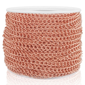 Macro view of rose gold stainless steel extender chain on a roll for DIY jewelry making