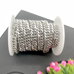 Macro shot of silver stainless steel curb chain rolls for DIY jewelry and bag accessories