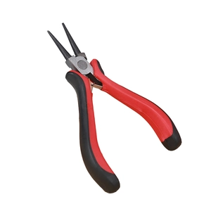 Close-up of needle-nose pliers with red and black ergonomic handles and spring mechanism